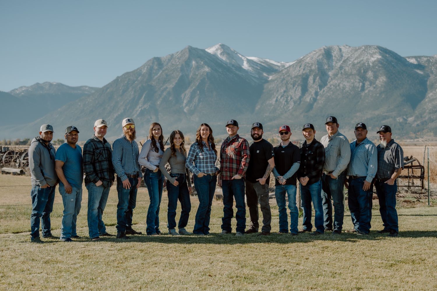 Park Ranch Meats Crew of 14 with Sierra Nevada Mountain range behind